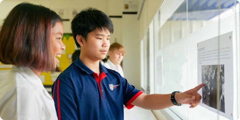Two students seeing photo
